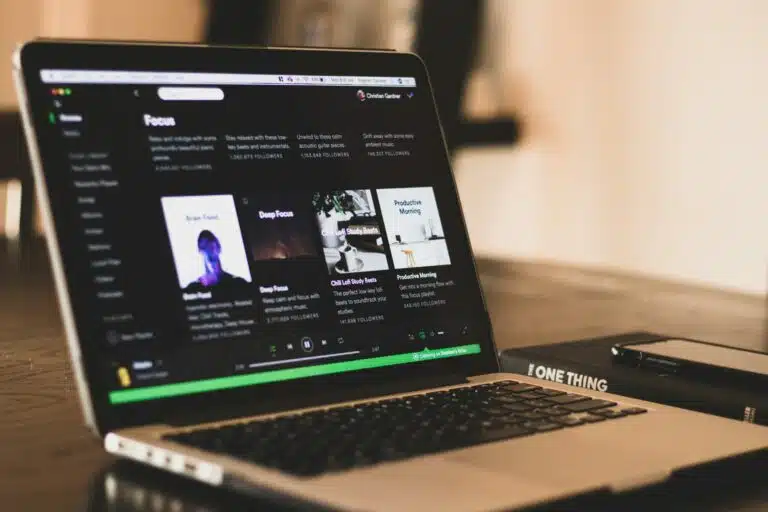 laptop displaying Spotify playlists which can make you money online 