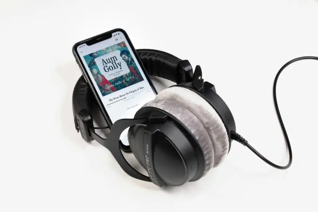 audiobook playing on cell phone with headphones 
