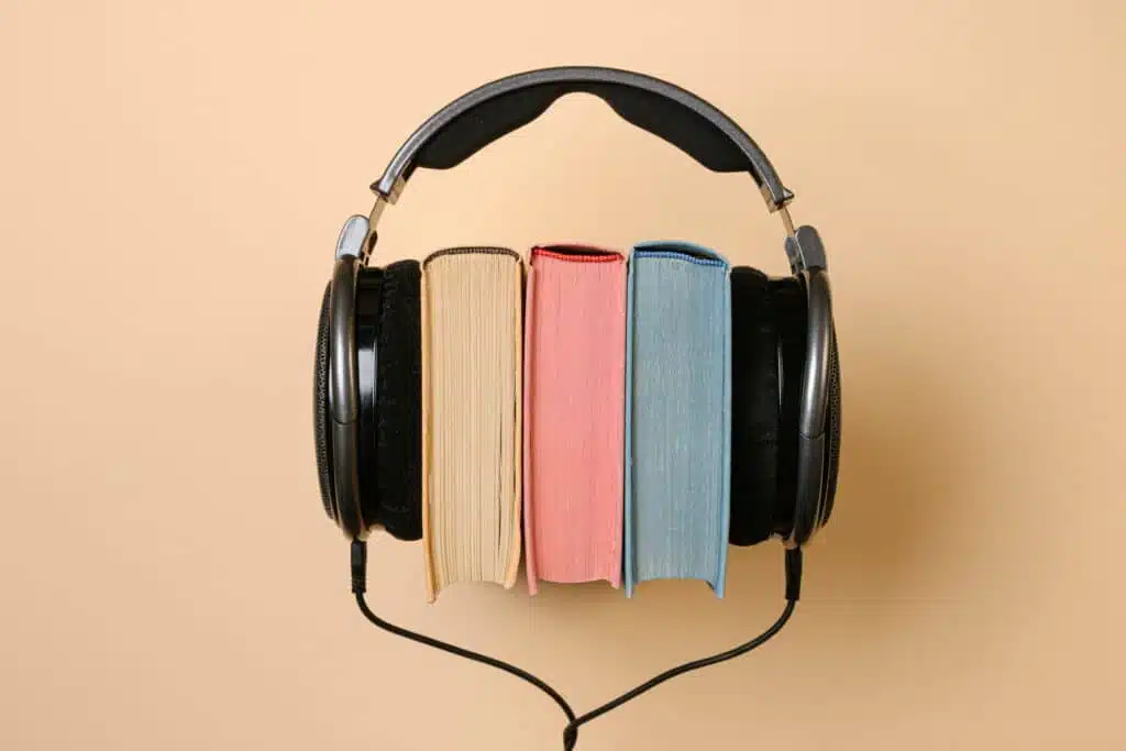 Book with headphones wrapped around, audio book recording studio Bay Eight in Miami