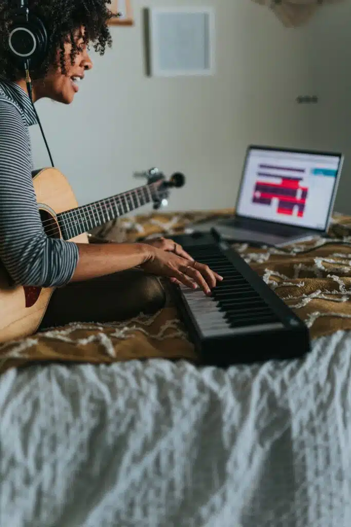 songwriter with piano and guitar soundtrap-1NAYqSlnXo8-unsplash